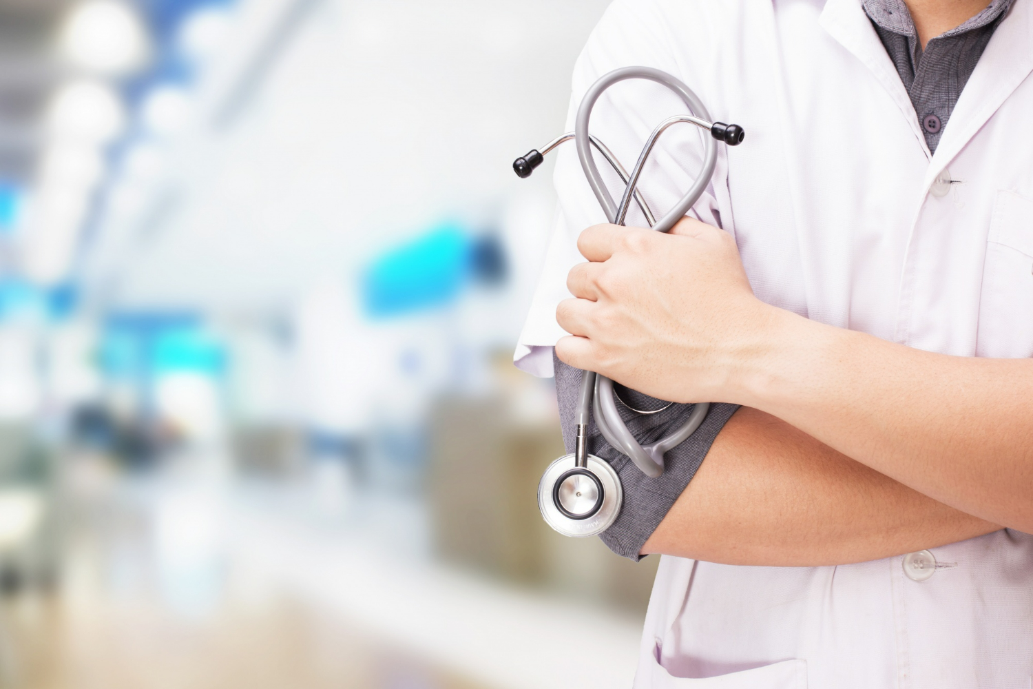 doctor-with-stethoscope-hands-hospital-background-healthcare